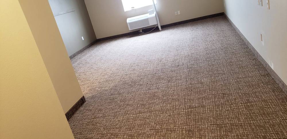 Room with freshly installed carpet